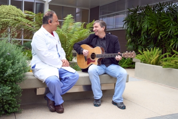 Dr. Ghaly and patient Mark Crenshaw reminisce in the Healing Garden at Torrance Memorial Medical Center.