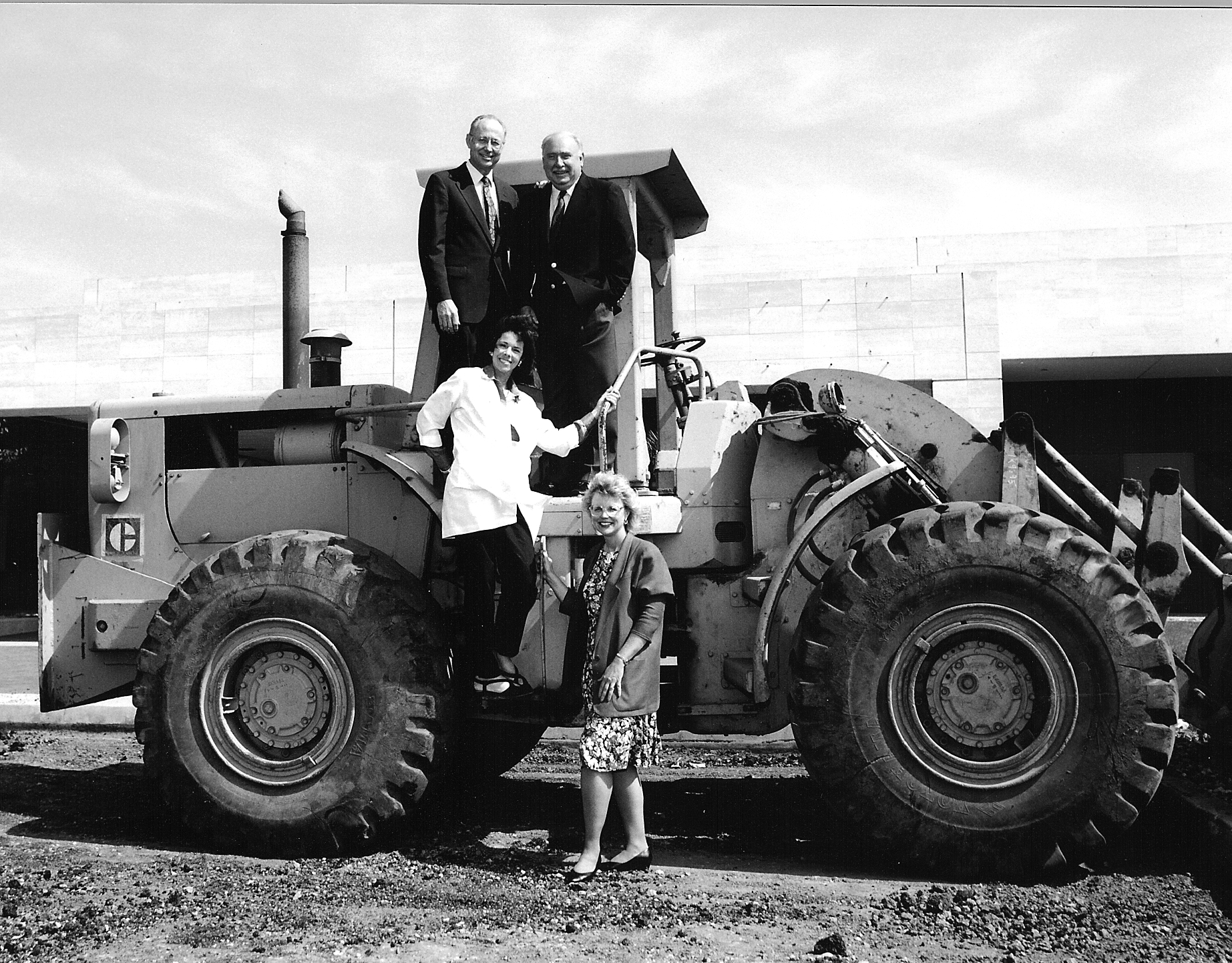 Robert Huber, MD, George Graham, Patricia Sacks, MD and Sally Eberhard aboard a bulldozer at the Polak Breast Diagnostic Center construction site