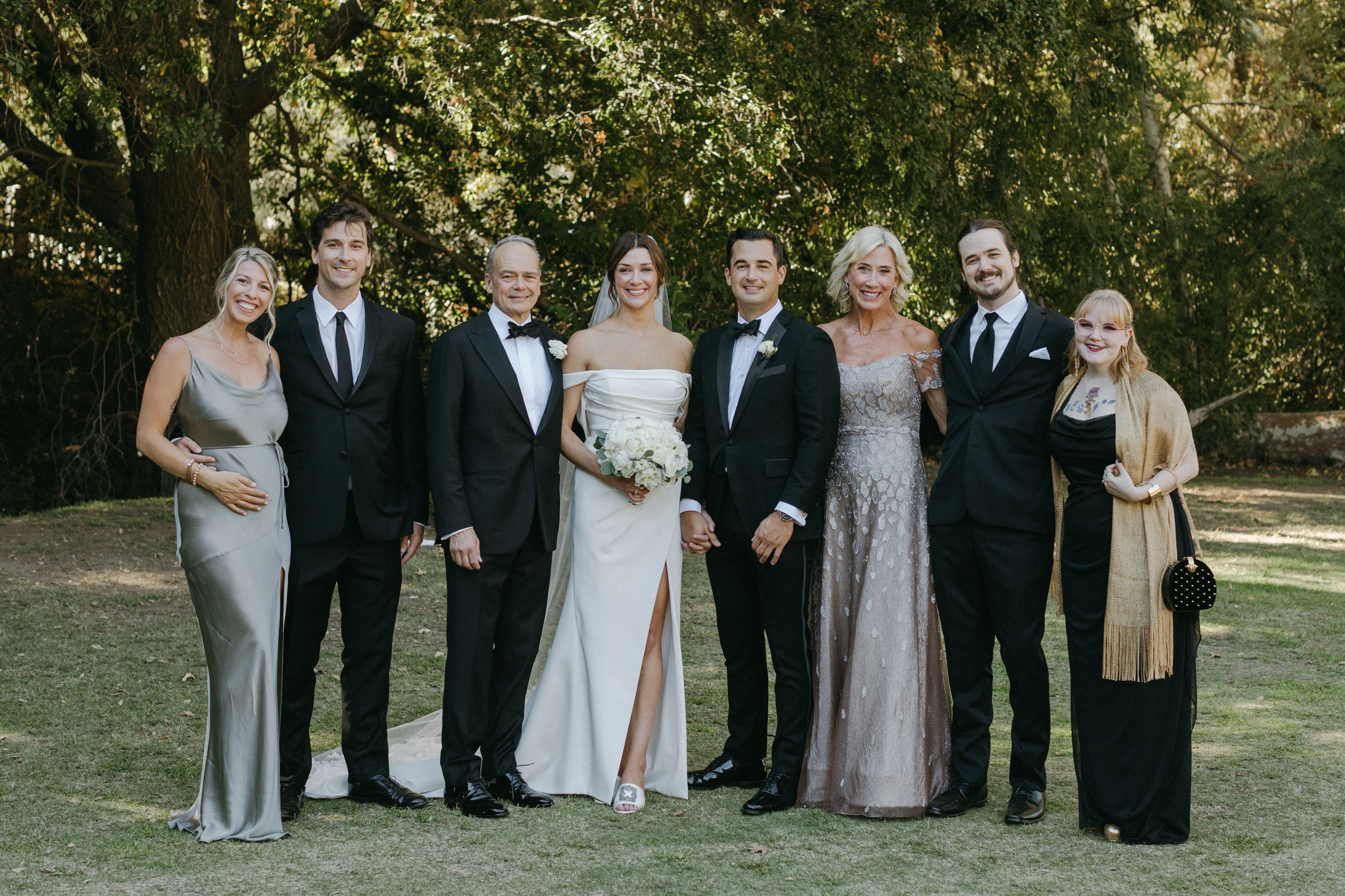 Celebrating the marriage of Ellie and Ben Bobit. Left to right: Marisa, Nick, Luke, Ellie, Ben, Rancy, Christopher and fiance Brynna White