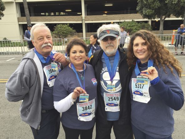 Terry Savolt, Jessie Savolt, Mark Lurie, MD, and heart failure nurse Roxanna Balter show their medals after the 2017 Redondo Beach Super Bowl 10K race.
