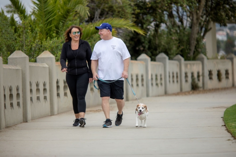 Susan and Mike Sestich enjoy a walk with Rosie.